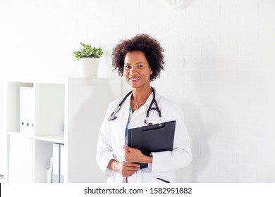 Woman Doctor Standing With Stetoscope Over Her Neck