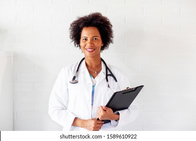 Woman doctor standing with stetoscope over her neck