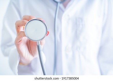 Woman doctor with a stethoscope in the hands