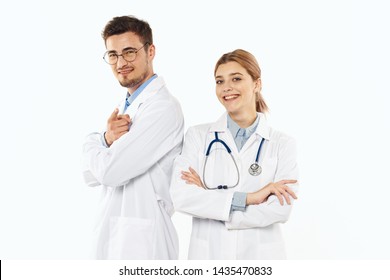 woman doctor with stethoscope and man stand with their backs to each other