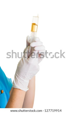 Woman in doctor uniform wearing latex gloves