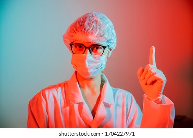 Woman Doctor Virologist, Infectious Disease, Epidemiologist, Dramatic Portrait, Wearing A Medical Mask Against Coronavirus