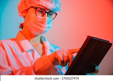 Woman Doctor Virologist, Infectious Disease, Epidemiologist, Dramatic Portrait, Wearing A Medical Mask Against Coronavirus