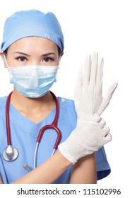 Woman doctor wearing medical gloves isolated on white background, model is a asian