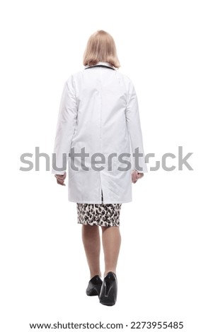 woman doctor in a white coat striding forward.