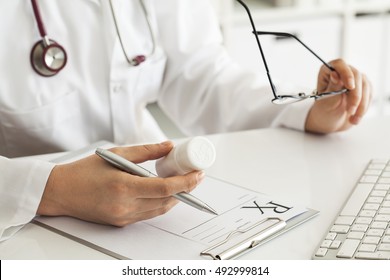 Woman Doctor Writing Prescription