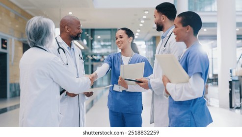 Woman, doctors and handshake with team in hospital for welcome, introduction and happy for success in corridor. People, medical staff and shaking hands with diversity, support and group at clinic - Powered by Shutterstock