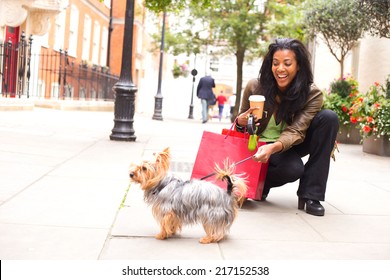 Woman With Dog And Shopping Bags.