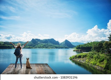 Woman With A Dog In The Summer Landscape