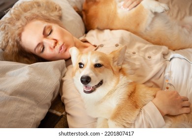 Woman And Dogs Lie On Bed, Family, Smiling. Relax, Spend Time Together, Enjoy And Have Fun. Lifestyle, Everyday Life. Kiss