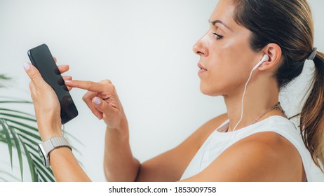 Woman Doing Audiogram Hearing Test At Home, Using Smart Phone And App.