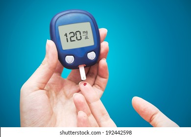 Woman Doing Blood Sugar Test