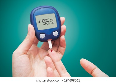 Woman Doing Blood Sugar Test