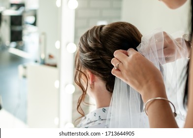 Woman Doing Bride Hairstyle With Brown Hair