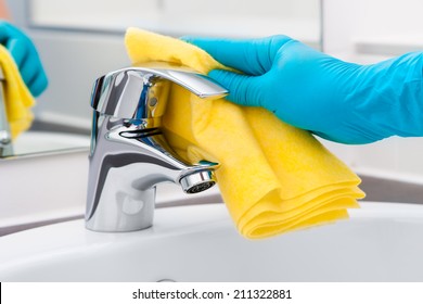 Woman Doing Chores In Bathroom, Cleaning Of Water Tap
