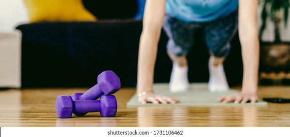 Woman Doing Exercise At Home Stay Fit Indoors Focus On Dumbells