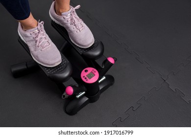 Woman doing exercise on stepper machine. Close-up photography of foots with copy space for text. - Powered by Shutterstock