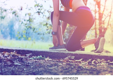 Woman Doing Exercises And Warm Up Before Run And Physical Fitness Test ; Healthy Lifestyle Cardio Together At Outdoors
