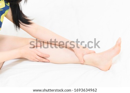Woman doing foot massage taken in studio