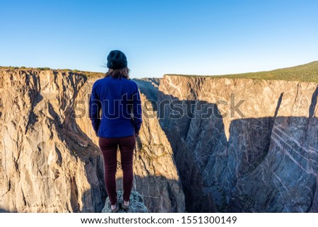 Woman Doing Handstands and Looking Over the Black Canyon of the Gunnison