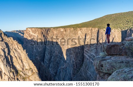 Woman Doing Handstands and Looking Over the Black Canyon of the Gunnison