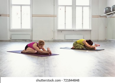 Woman Doing Head To Knee Yoga Pose