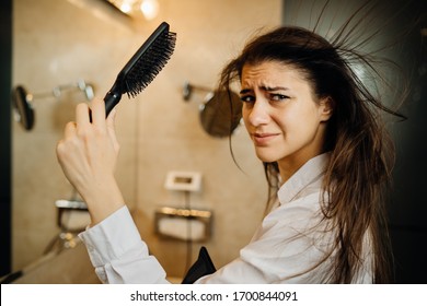 Woman Doing Her Hair Styling With A Brush At Home.Bad Hair Day.Daily Hairstyle Preparation Routine.Heat Damage,split Ends,dry Hair Loss.Getting Ready For Work.Blow Drying DIY Haircut.Home Hair Care