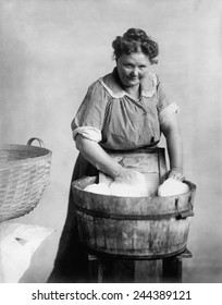 Woman Doing Laundry In Wooden Tub And Metal Washboard, Ca. 1905.