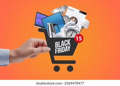 Woman doing online shopping, she is holding a shopping cart icon full of goods, Black Friday sale concept