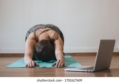 Woman Doing Online Yoga At Home