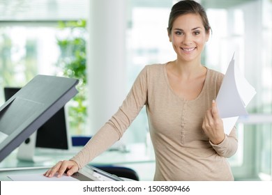 woman doing photocopies in the office