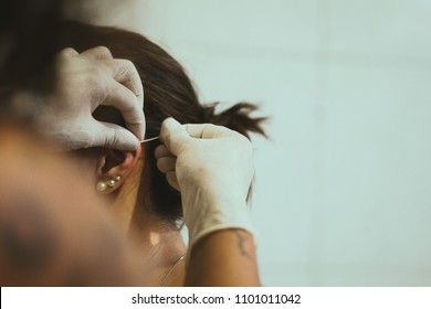 Woman doing piercing