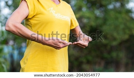 woman doing qi gong outdoors