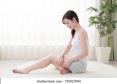 Woman Doing Self Massage, Thighs, Foot