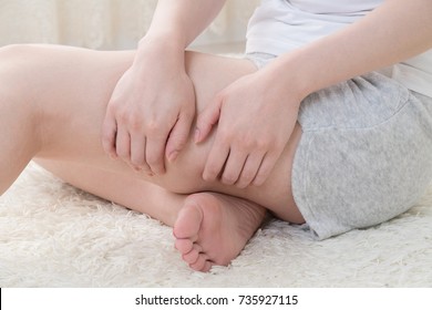 Woman Doing Self Massage, Thighs, Foot