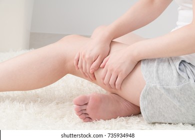 Woman Doing Self Massage, Thighs, Foot