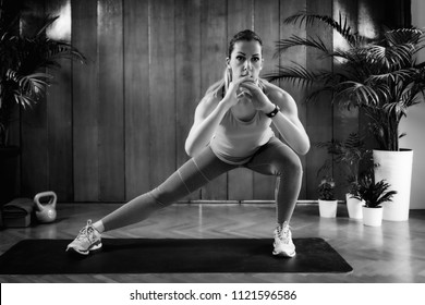 Woman Doing Side Lunges On High-intensity Interval Training At Home