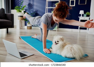 Woman doing some yoga exercises at home