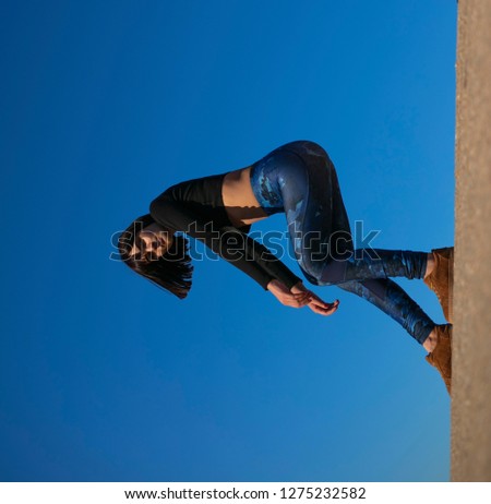 Similar – Image, Stock Photo Tattooed woman in front of a painted wall