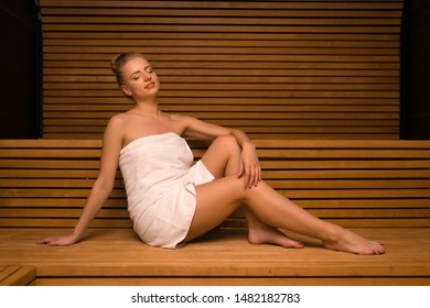 Woman Doing A Steam Bath In A Wooden Sauna Room