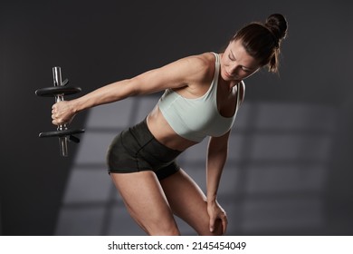 Woman Doing Triceps Workout With Light Dumbbell