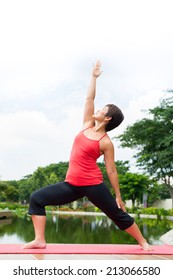 Woman Doing Warrior Pose By The Pound