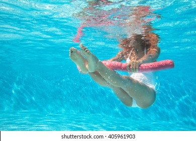 woman doing water aerobics in a swimming pool 
 - Powered by Shutterstock