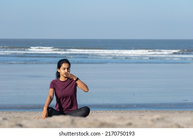 Woman Doing Yoga Anulom Vilom, Breathing On Beach. Jogging, Workout, Exercise, Healthy Life, Diet, Lifestyle, Sedentary, Active, Fresh, Fitness, Periods, Sunlight, Muscle, Work Life Balance Concept.