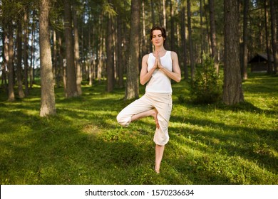 Woman Doing Yoga In Forest