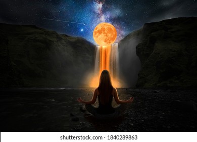 Woman doing yoga in front of a magic waterfall