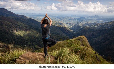 Woman Doing Yoga On Top Of Little Adam's Peak In Ella, Sri Lanka