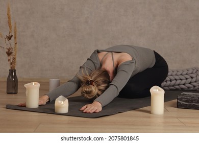 Woman Doing Yoga Pain Relief Stretching At Home. Self Care, Healing Concept