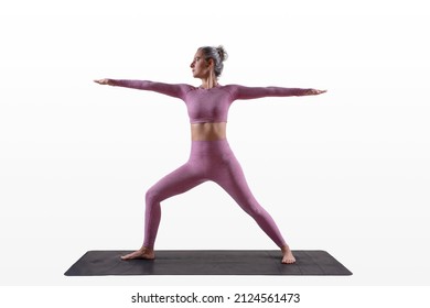 Woman Doing Yoga - Warrior 2 - Virabhadrasana