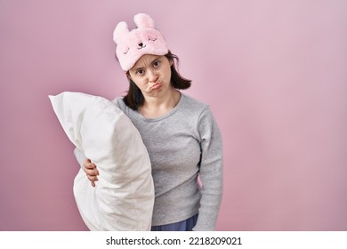 Woman With Down Syndrome Wearing Sleeping Mask Hugging Pillow Depressed 